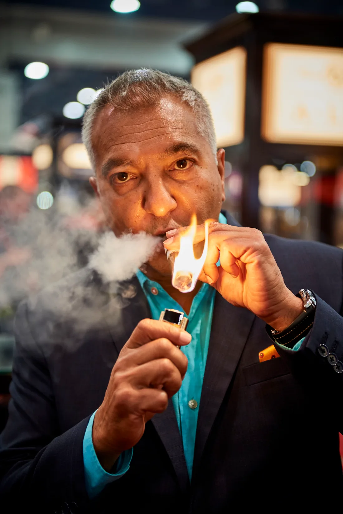Cigar icon Rocky Patel enjoying a cigar
